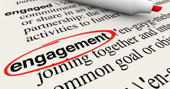 Engagement word circled in a dictionary definition to illustrate meaning of the word in business attracting customers with involvement and participation