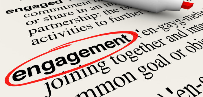 Engagement word circled in a dictionary definition to illustrate meaning of the word in business attracting customers with involvement and participation