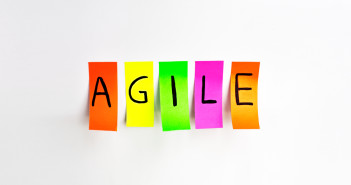 Image inscriptions of agile. Agile methodology writing colors stickers isolated on white background of white board.