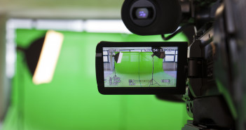 LCD display screen on a High Definition TV camera in a green screen studio.