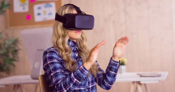 casual worker using oculus rift in her office