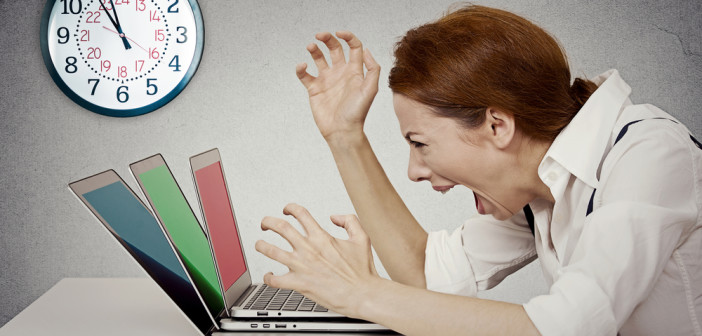 businesswoman screaming at computer