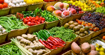 Fruit market with various colorful fresh fruits and vegetables